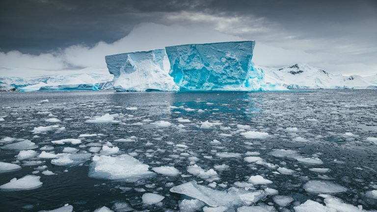 Iceberg Sits Still On A Calm Day In Antarctica