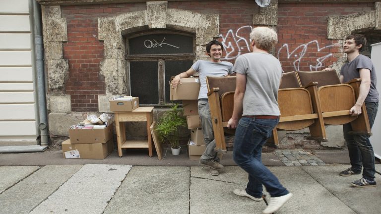 Young Men Helping A Friend Move